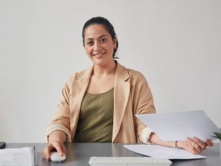 woman sits in her room