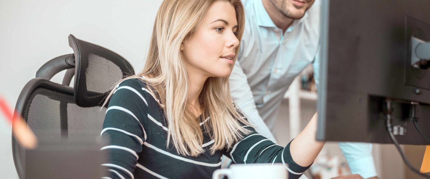 Woman and man in the office at avitea