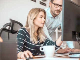 Woman and man in the office at avitea