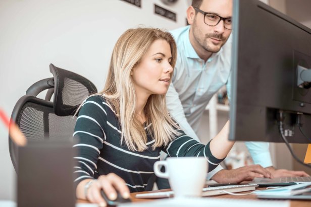Woman and man in the office at avitea