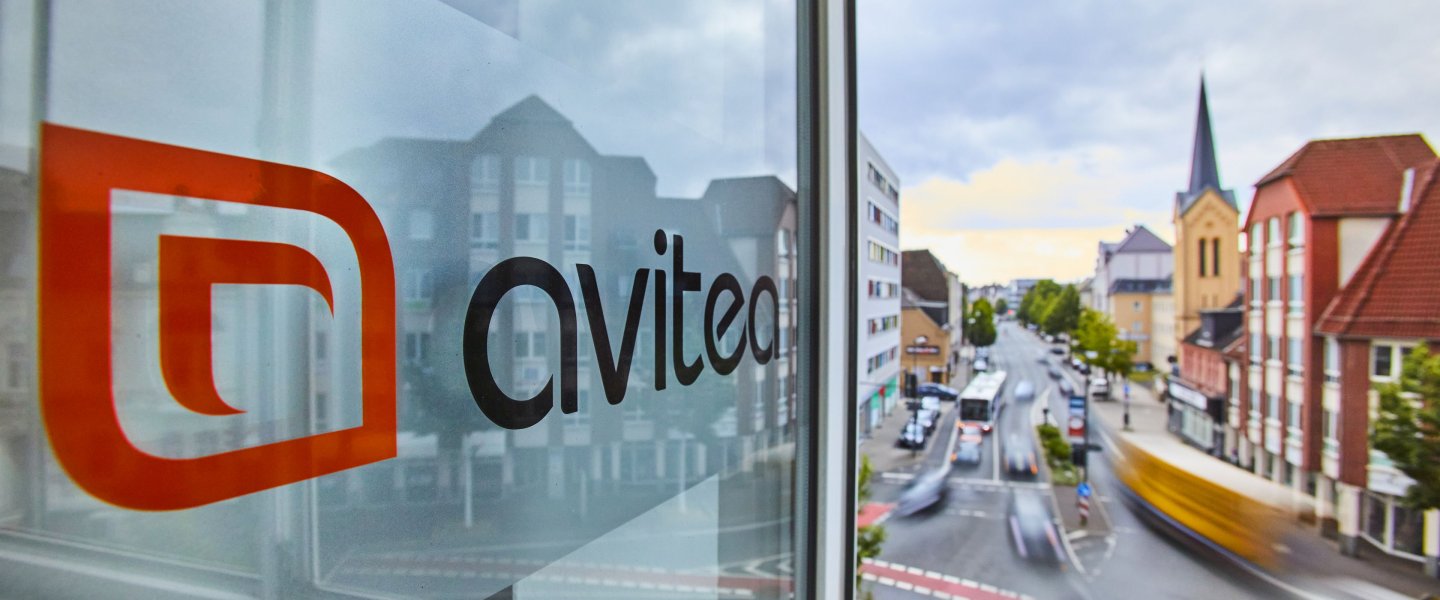 avitea logo in the window at Recklinghausen location with view of street